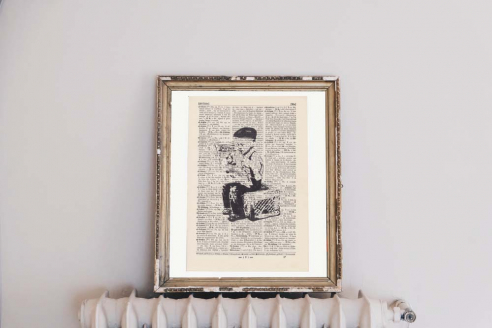 Bustart - Newspaper Boy - Print on antique book page